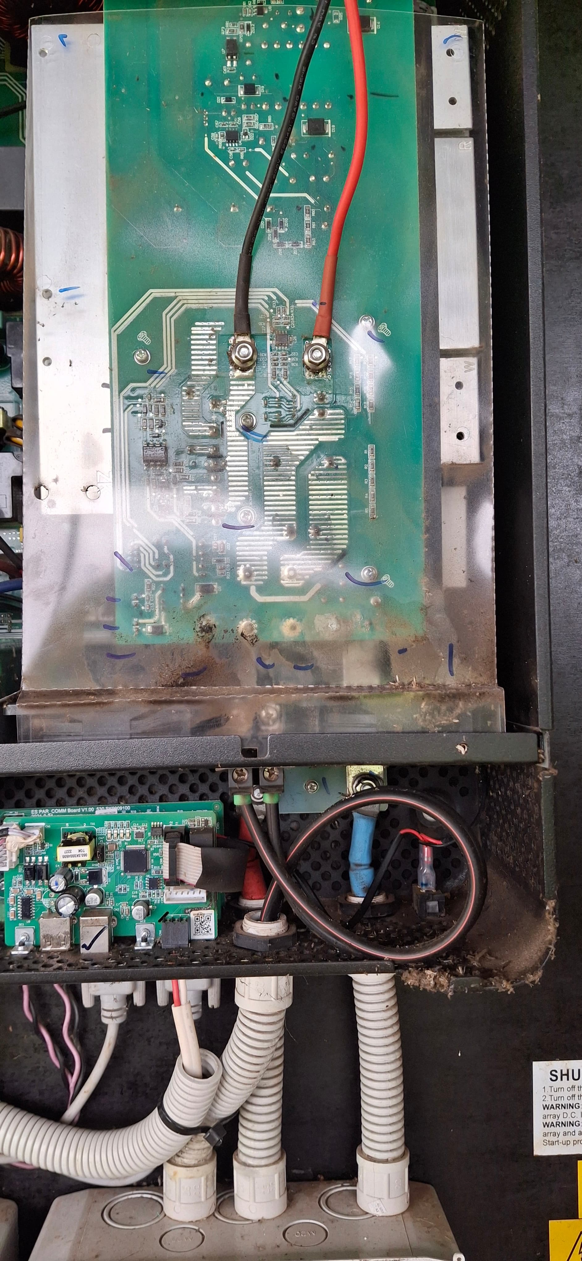 Inverter control board exposed during a commercial air conditioning fault-finding job
